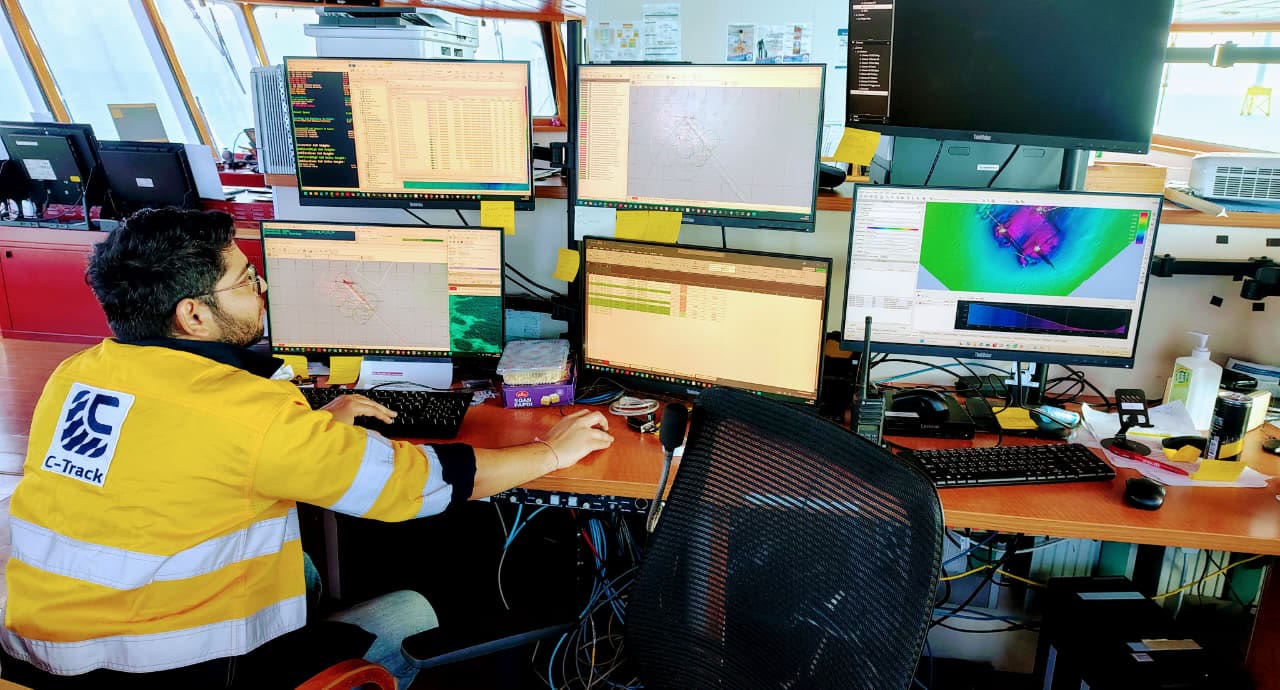 C-TRACK surveyor processing bathymetry in a vessel survey room
